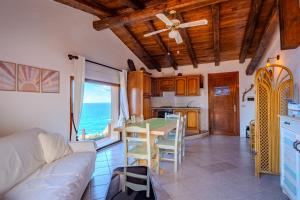 a living room with a couch and a table at Casa Paradiso Guest House in Costa Paradiso +67 photos