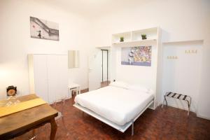 Ένα ή περισσότερα κρεβάτια σε δωμάτιο στο Manara10 Apart giallo2