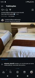 Ένα ή περισσότερα κρεβάτια σε δωμάτιο στο Hotel portal dos anjos