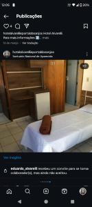 Ένα ή περισσότερα κρεβάτια σε δωμάτιο στο Hotel portal dos anjos