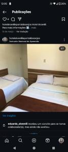 Ένα ή περισσότερα κρεβάτια σε δωμάτιο στο Hotel portal dos anjos