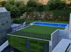 an image of a swimming pool on top of a building at Apartamento Rocio in Baiona