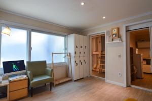 TV o dispositivi per l'intrattenimento presso Helloworld guesthouse