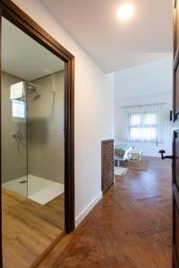 a glass door leading into a room with a living room at Finca Tolombreo Casa Gabriel in Cudillero +47 photos