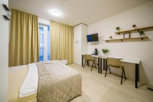 Ένα ή περισσότερα κρεβάτια σε δωμάτιο στο APARTIA apartments Brno-center
