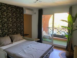 Postel nebo postele na pokoji v ubytování Le Sable Blanc - Studio - Piscine
