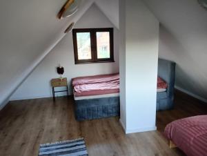 a room with a bed and a window at Osada Blanka Leśny Zakątek Jezioro Rzeka Swornegacie in Swornegacie 