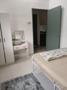 Postel nebo postele na pokoji v ubytování DerCha Homestay near Tampin, FREE WIFI