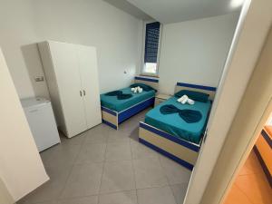 Postel nebo postele na pokoji v ubytování Namelijan's Hotel