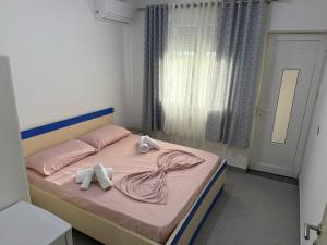 Postel nebo postele na pokoji v ubytování Namelijan's Hotel