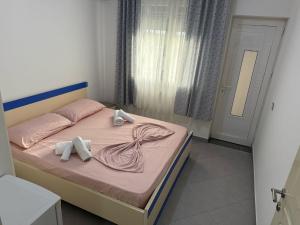 Postel nebo postele na pokoji v ubytování Namelijan's Hotel