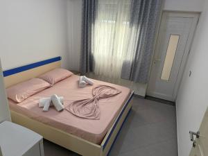 Postel nebo postele na pokoji v ubytování Namelijan's Hotel