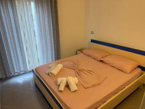 Postel nebo postele na pokoji v ubytování Namelijan's Hotel