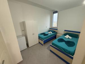 Postel nebo postele na pokoji v ubytování Namelijan's Hotel