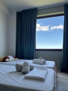 A bed or beds in a room at Aletraki -Off-Grid Retreat Above Heraklion, Peaceful Views