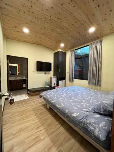 Postel nebo postele na pokoji v ubytování Sunshine Homestay