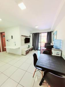 Uma TV ou centro de entretenimento em Resort Beira-Mar - Porto de Galinhas