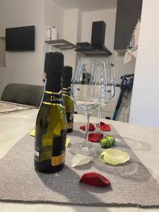 a bottle of wine and a glass on a table at La casetta di Giogi in Sutri +59 photos