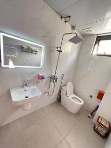 a bathroom with a sink and a toilet at NamiStay Ninh Bình - Linh Đức in Ninh Binh