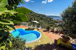 a swimming pool in the middle of a yard at Villa Margherita Amalfi Coast in Vietri sul Mare