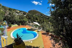 a swimming pool with a view of a mountain at Villa Margherita Amalfi Coast in Vietri sul Mare