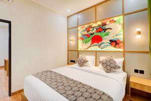 Postel nebo postele na pokoji v ubytování Collection O Samurai Hotel