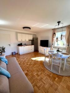 a living room with a couch and a table at Oaza Narave in Spodnje Gorje