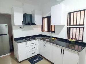 Kuchyň nebo kuchyňský kout v ubytování Dantis Apartments Magodo + 2 fotografie