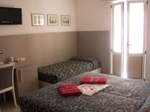 Postel nebo postele na pokoji v ubytování Hotel Imperiale & SPA