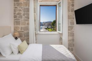 Ένα ή περισσότερα κρεβάτια σε δωμάτιο στο Meridiem Apartment