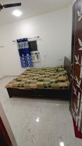 a bedroom with a bed in a room at Hotel DEEPAK PALACE in Gaya