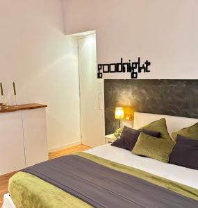 a bedroom with a bed and a sign on the wall at Ca' Emma in Venice +24 photos