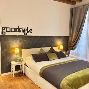 a bedroom with a large bed and two lamps at Ca' Emma in Venice