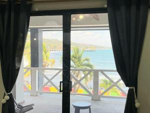 a view of the ocean from a room with a window at Litos Hotel in La Libertad