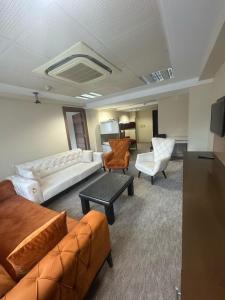 a large living room with a couch and chairs at körfez otel in Edremit +17 photos