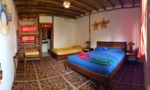Postel nebo postele na pokoji v ubytování Suites La Tortuga