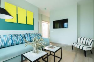 Μια τηλεόραση ή/και κέντρο ψυχαγωγίας στο Sercotel Sevilla Guadalquivir Suites