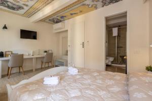 a bedroom with a bed and a bathroom at Locus Amoenus in Riomaggiore +53 photos