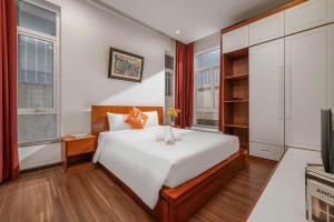 Ένα ή περισσότερα κρεβάτια σε δωμάτιο στο Villa Hội An Large