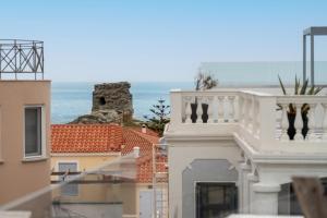 a view of the ocean from the balcony of a building at Castel Abaso Boutique Apartments by Explore Andros in Andros