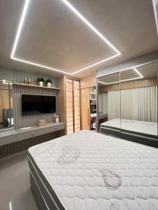 Ένα ή περισσότερα κρεβάτια σε δωμάτιο στο Luxury Flat Ritmo Bueno