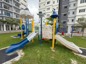 a playground in a park with a slide at Balcony Forest Lake Mountain in Kampar