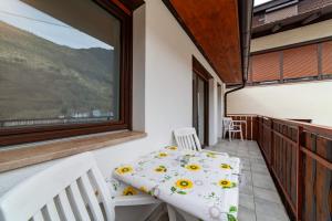 a room with a balcony with a bed and a window at Residence Sonja in Naturno
