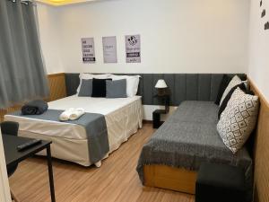 En eller flere senge i et værelse på Casa da Marquês