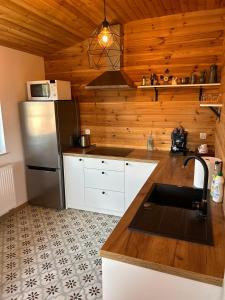 Kuchyňa alebo kuchynka v ubytovaní I - Apartament na Warmi dla rodzin z dziećmi