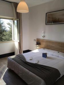 Łóżko lub łóżka w pokoju w obiekcie LH Hotel Excel Roma Montemario