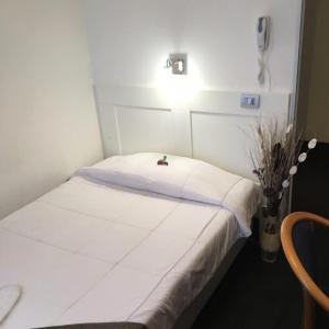 Łóżko lub łóżka w pokoju w obiekcie LH Hotel Excel Roma Montemario