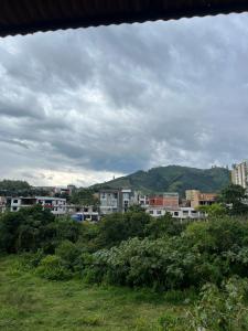 a view of a city with buildings and trees at apartamento mirador el paraiso in Santa Rosa de Cabal +21 photos