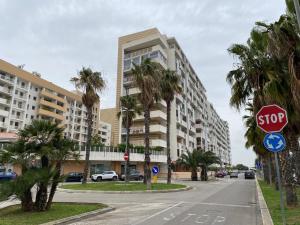 a stop sign on a street with a building at AF Apartments FaraOne in Bari