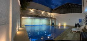 a large swimming pool in the middle of a building at KALINA HOTEL in Girardot